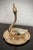 Excellent Pre-Owned Condition. Graceful and diminutive, this lovely-to-look at brass swan on a dish ring holder will keep...
