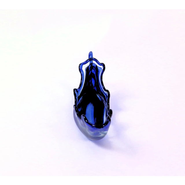 Blue Murano swan bowl in gradated colors of royal blue, cerulean blue, and clear glass. The graceful wings and neck of the...