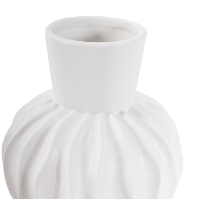 The Herring Vase is a striking abstract matte white vase that is crafted with intricate forms and textures. With its...