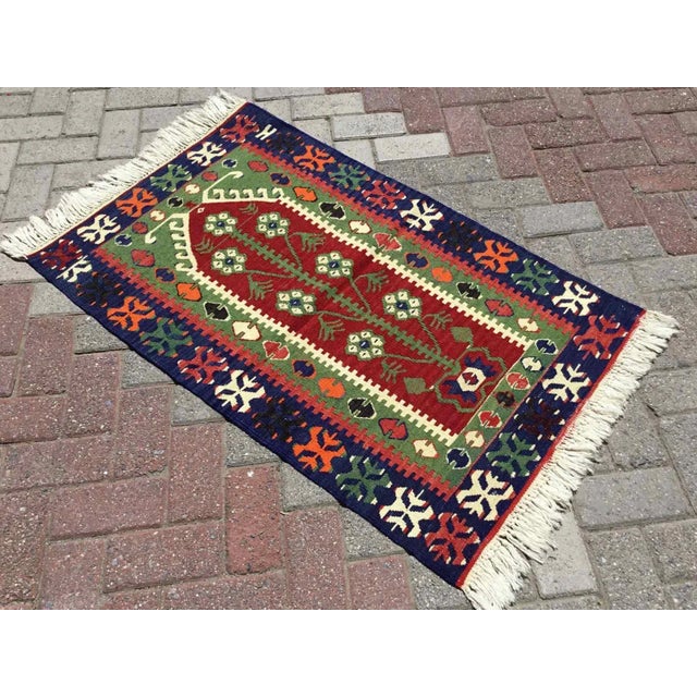This beautiful, vintage, handwoven kilim is approximately 60 years old. It is handmade of very fine quality, hand-spun...