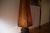 This is a rustic floor lamp from the 1930s. The lamp is a unique, handcrafted piece from that era, made from an old wheel...