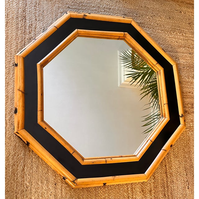 An elegant octagonal mirror designed by Vivai del Sud, crafted entirely from natural bamboo rods, with meticulous...