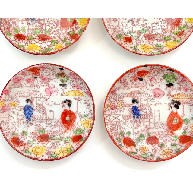 A very beautiful set. The colors are still so vivid despite their age. Each plate is 3.25"