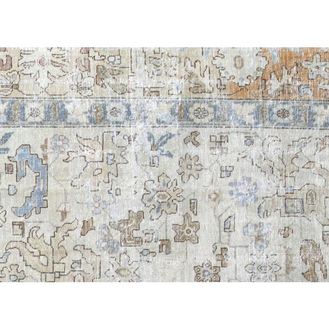 This Semi Antique Persian Tabriz Rug is handwoven in Northern Iran's Tabriz region. It has been carefully distressed and...