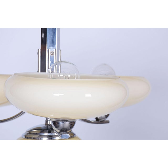 This unique chandelier, created in Czechoslovakia during the 1920s, carries the unmistakable signature of the transitional...