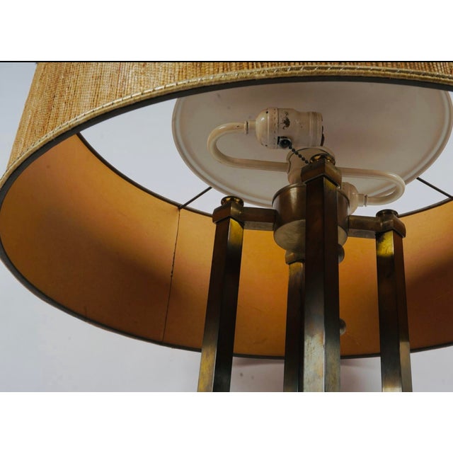 An exceptional vintage brass table lamp designed by Tommi Parzinger for Stiffel, featuring a striking architectural...