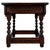 A charming early 20th-century English side table, finely crafted from oak and distinguished by its compact proportions,...