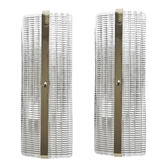 Set of two trasparent diamanted murano glass wall sconces with metal frame on view in chrome. murano glass with a...