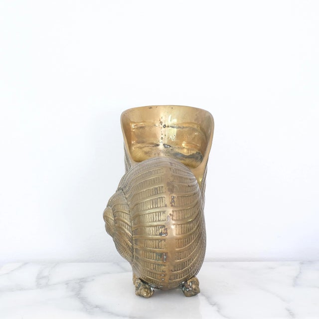 Brass nautilus shaped champagne bottle holder, in great condition.