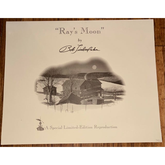 The Bob Timberlake "Ray's Moon" Lithograph Print is a large, framed piece of art measuring 42 inches in length and 37...