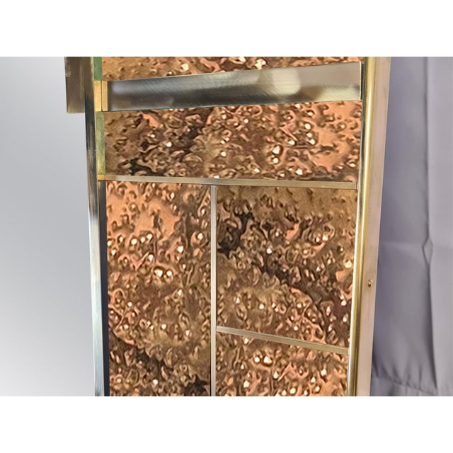 This exquisite rectangular wall mirror with dotted brass, made in Italy, is a stunning addition to any modern interior....