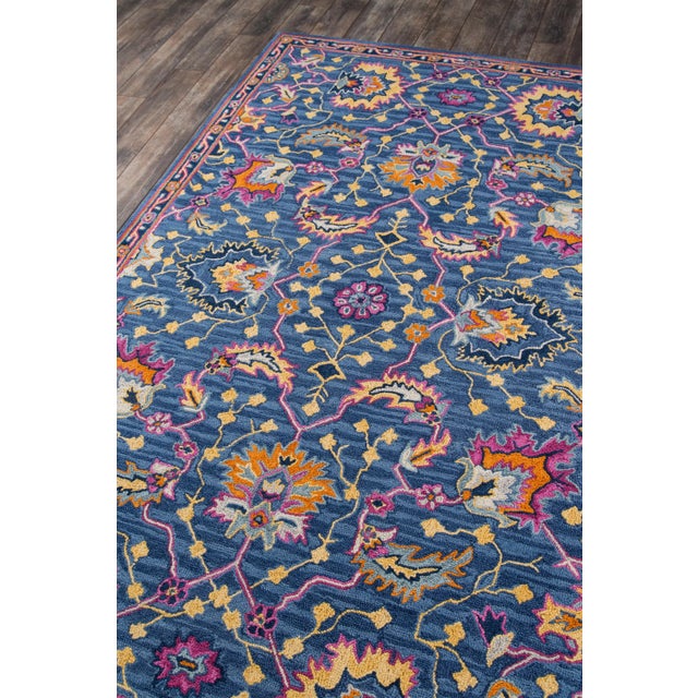 The saturated shades of this decorative area rug reinvent the classic Persian carpet in a vivid color palette. The...