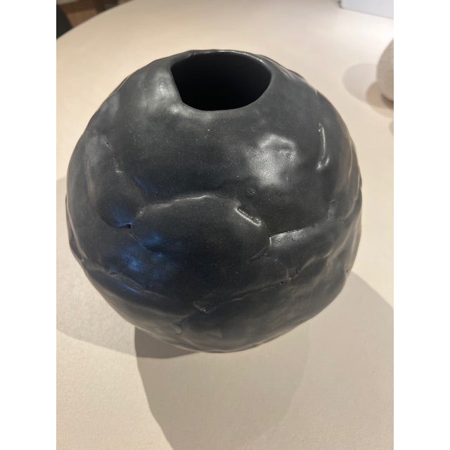Dimensions: 7.5’ dia x8’ h Material: stoneware Finishing: unglazed Color: black Edition: one-a-of-a-kind