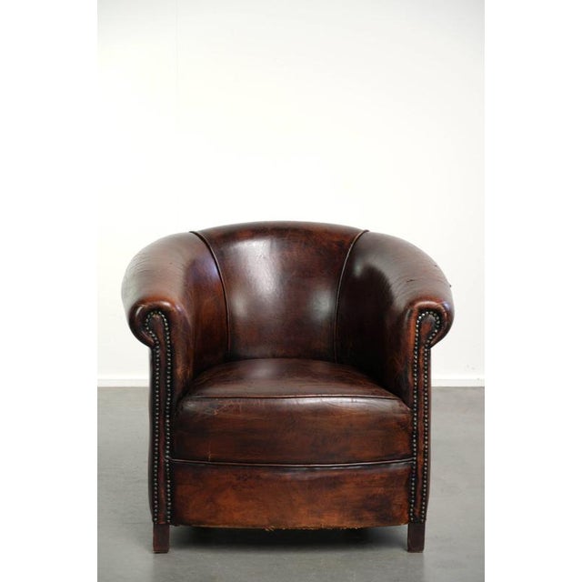 This charming vintage sheepskin club chair is modest in size and features beautiful, warm colors. This beloved club chair...