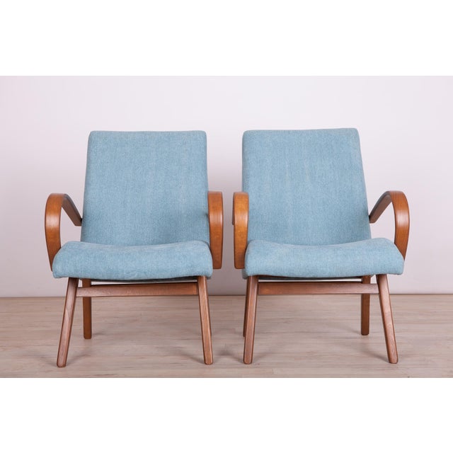 This pair of model 53 armchairs was manufactured by Ton in the 1950s to 1960s. They were designed by Jaroslav Smidek. The...
