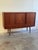 Mid-century modern Danish sideboard attributed to E.W. Bach for Sejling Skabe, produced in the 1960s. Crafted in richly...