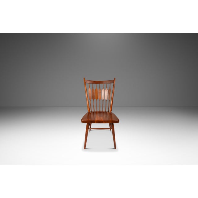 Introducing a rare, expansive set of six visually captivating "Centennial" dining chairs designed by the iconic design duo...