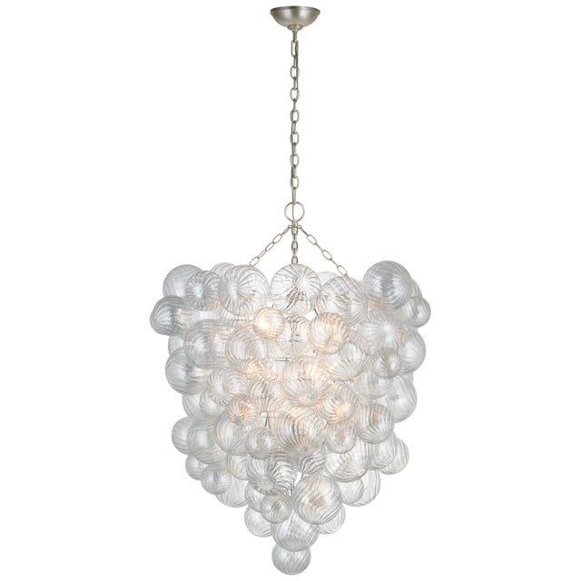 Talia Grande Entry Chandelier in Burnished Silver Leaf with Clear Swirled Glass Designer: Julie Neill Canopy: 6" Round...