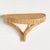 This simple rattan wrapped woven bracket is a casual decorative shelf for your favorite accent pieces. A coastal look...