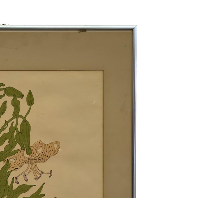 Framed botanical illustration depicting a Tiger Lily (Lilium tigrinum), created and signed by Wendy Wheeler. The artwork...