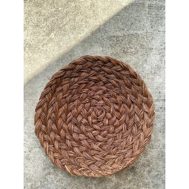 Celebrate the timeless beauty of natural craftsmanship with this vintage handwoven rattan bowl, a striking decorative...