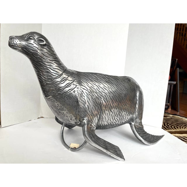 Just in this Very Unique Seal Wine Bottle Cooler, in Cast Stainless Steel, Italy This seal can contain three bags of ice...
