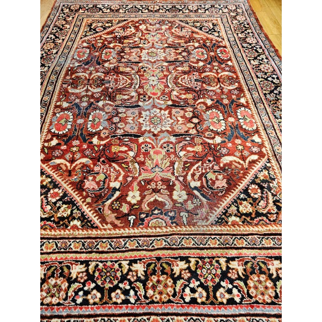 "The early 20th century Persian Mahal Sultanabad room size rug in an allover large format pattern. The design is set...