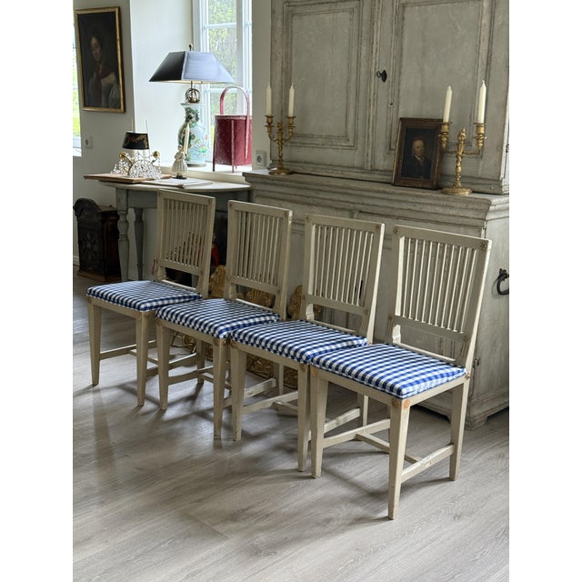 These chairs from around 1850 are four old pieces. It is a provincial work with pastel decor and very subtle gilding. The...