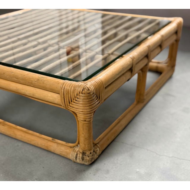 Authentic vintage Brown Jordan Rattan square cocktail table featuring a sculptural natural rattan frame, distinctive...