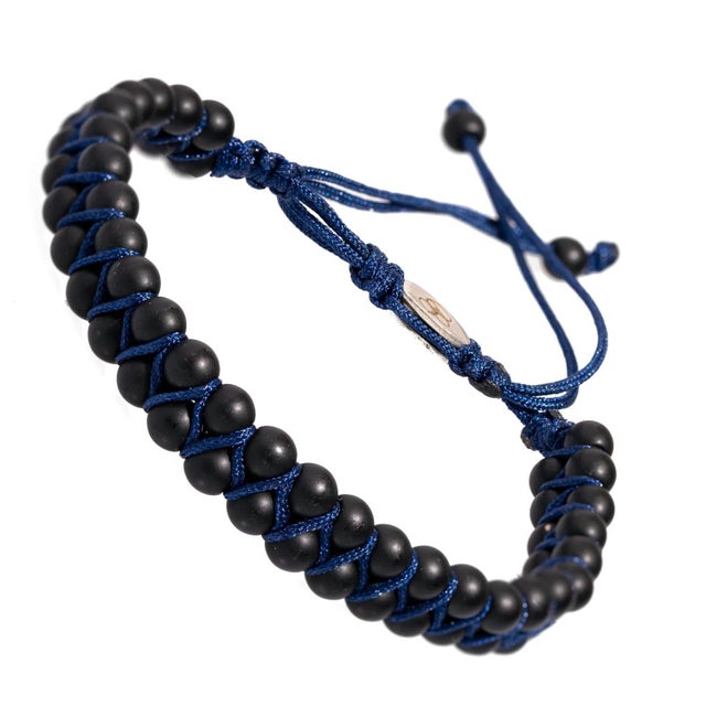 The Black Onyx Stone Beaded Blue Rope Striking Bracelet is a sleek and stylish piece of handmade jewelry that is perfect...