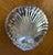 Vintage silver-plate dish is molded in form of a classic scallop shell. Back is stamped silver-plate with letter S of...