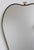 Mid-century italian wall mirror with brass frame (circa 1960s). The mirror is uniquely-shaped, reminiscent of an apple,...