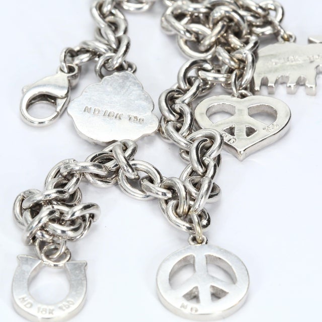 - Stone Info - Brilliant Cut Diamonds ~0.01ct each VS2 Clarity, E Color - Materials - 18k White Gold - Design Elements -...