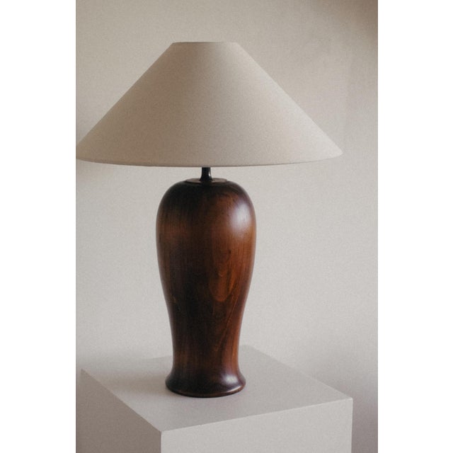 Large Wooden Table Lamp, in Very Good conditions. Designed 1970 to 1979 European Plug (up to 250V).The wiring of this item...