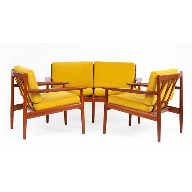 Svend Åge Eriksen Sofa Set for Glostrup Møbelfabrik, 1960s. Yellow armchair set consisting of a sofa and two armchairs in...