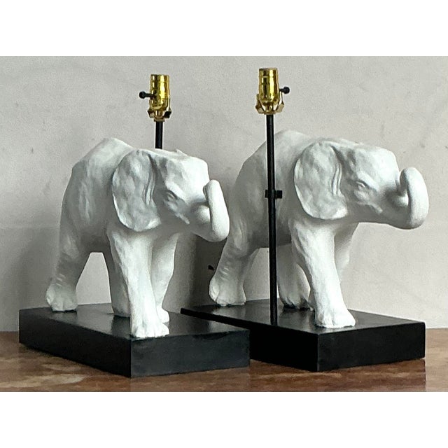 A whimsical yet sophisticated lighting element, this vintage table lamp features a beautifully sculpted elephant finished...
