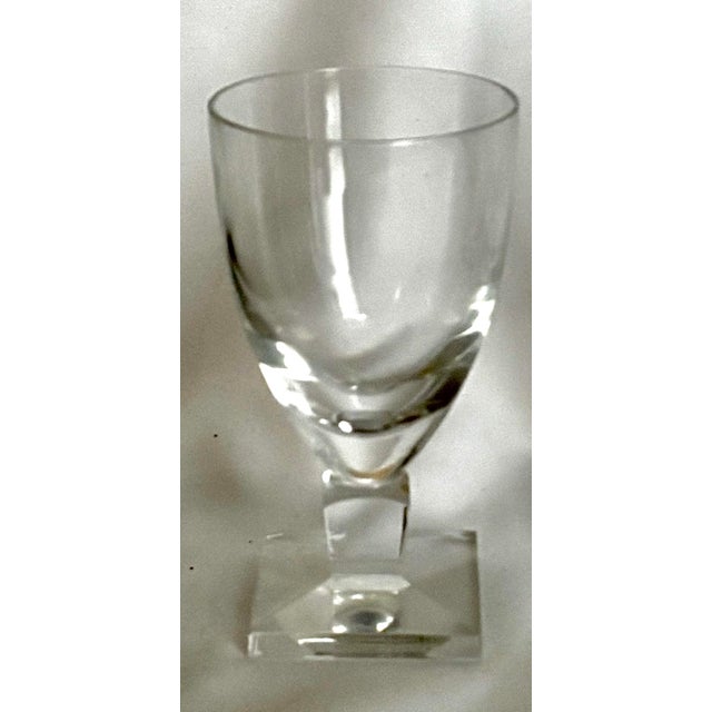 An elegant set of eight Orrefors crystal claret glasses in the Gustav Adolf pattern. Designed by Simon Gates for Orrefors...