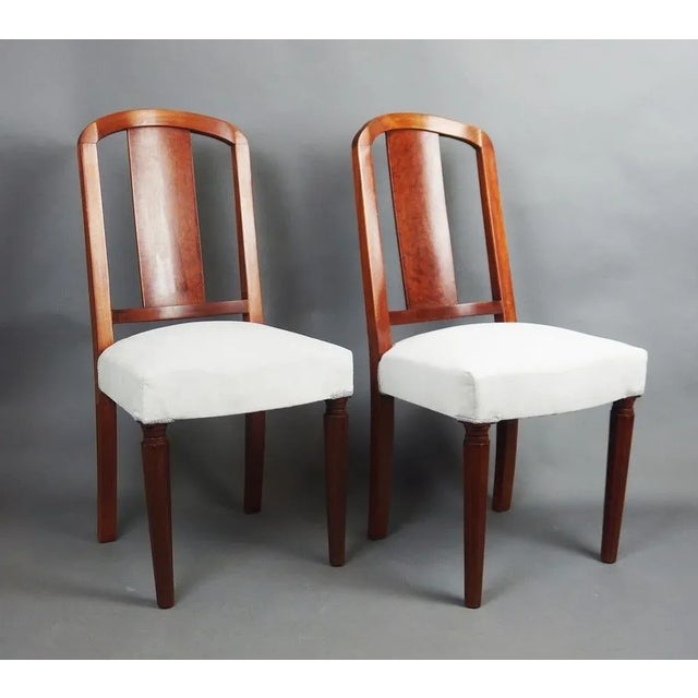 Pair of Art Deco armchairs,burr walnut veneer in the center of the back,mahogany uprights and base,light gray velvet...
