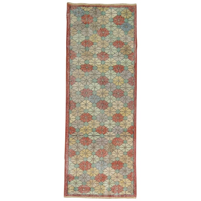 A shabby chic Turkish runner with an all-over floral design. 2'8'' x 7'1''