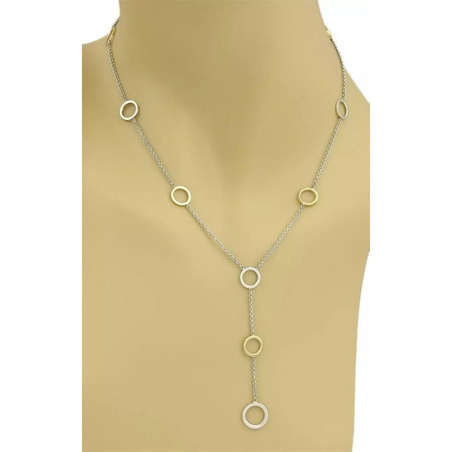 This elegant authentic Tiffany & Co.necklace is finely crafted from solid 18k yellow gold and sterling silver with a...