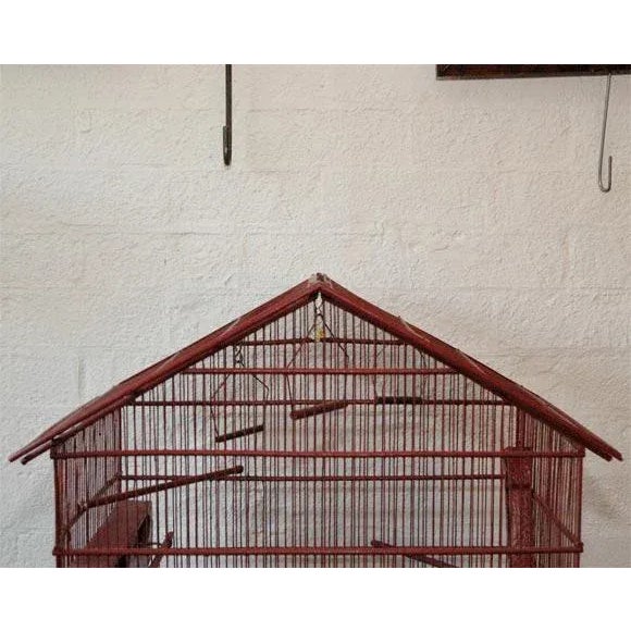 A nice size, bright and decorative bird cage. France, circa 1930's Materials and Techniques: Wood, Brass, Paint....