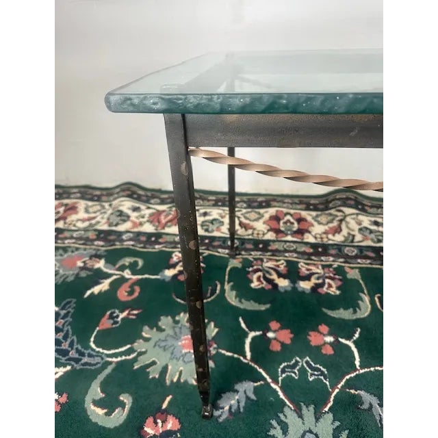 Elevate your space with this Iron Frame Table with Live Edge Glass Top by Charleston Forge. Featuring a sleek, hand-forged...