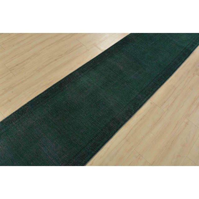 An authentic vintage traditional overdyed Tabriz runner hand-knotted with fine wool and natural dyes. This oriental rug...