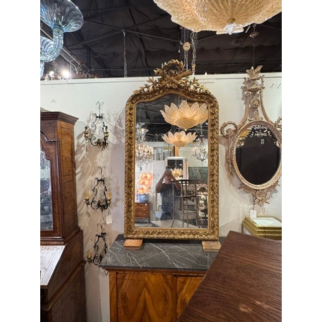 The 19th c. French Louis XVI Giltwood Mirror is an and elegant addition to any room. Featuring beautiful carved details...