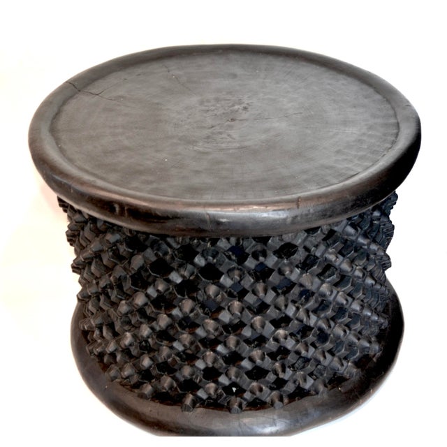 A wonderful Mid Century intricately wood carved spider stool by the Bamileke people of Cameroon with exceptional...