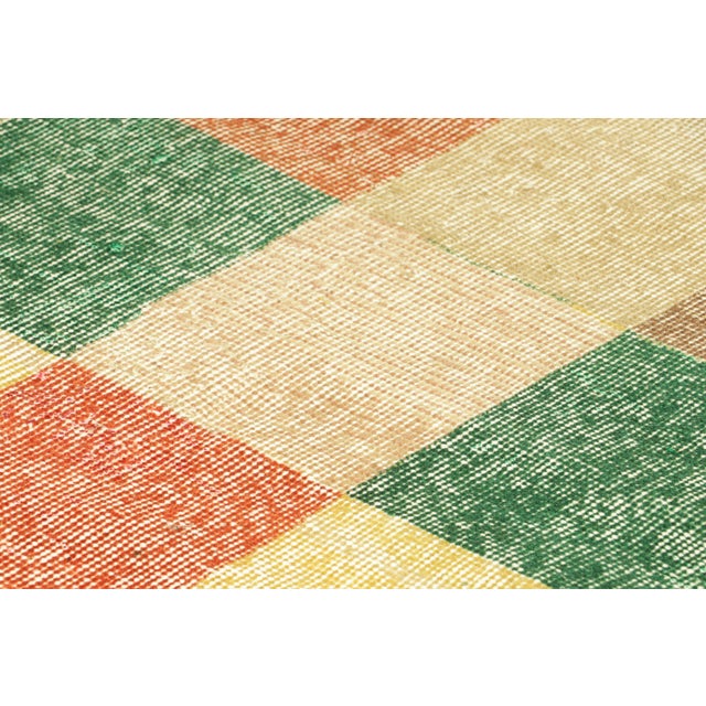 Hand-knotted in wool circa 1960-1970, this 2x5 vintage rug is an exciting new piece in Rug & Kilim’s Mid-Century Pasha...