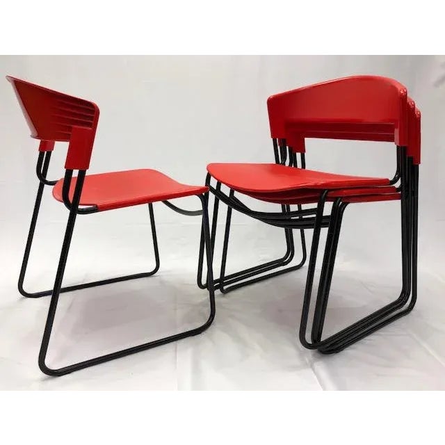 Retro mid-century modern in classic red & black. Original classic and versatile chair, designed by Paolo Favaretto for...