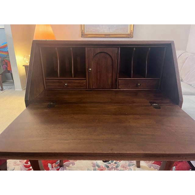 Bring classic Southern craftsmanship and timeless elegance into your home with this beautiful vintage slant-front...