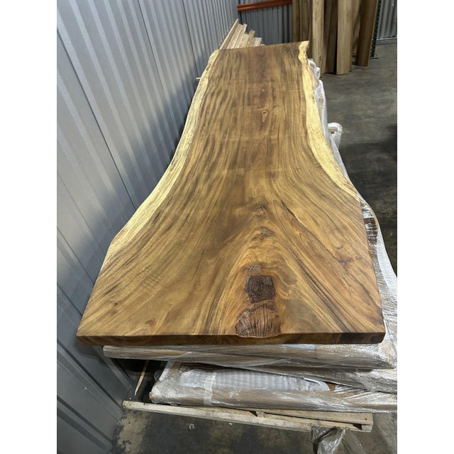 One tree. One top. One of one. A true single-slab live edge table: one continuous cross-section of a single Saman tree...