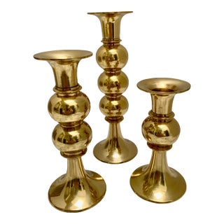 Vintage Set of Three Staggered Height Shapely Brass Candleholders For Sale